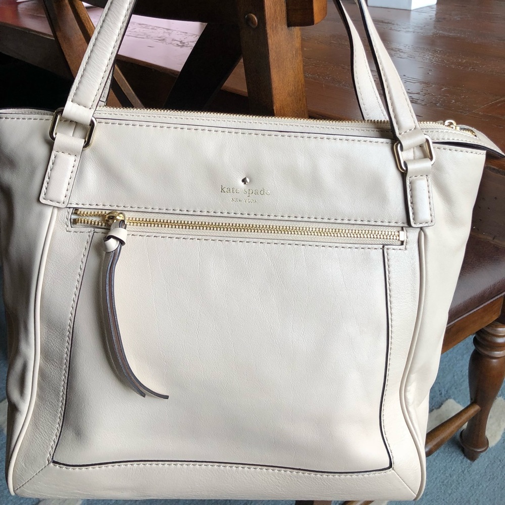 Nude pink Kate spade purse.